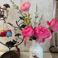 All Dressed Up roses in a vase arrangement with other fresh-cut flowers on a tabletop