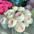 Florist bouquet featuring Emma Woodhouse cut roses with large, full blooms